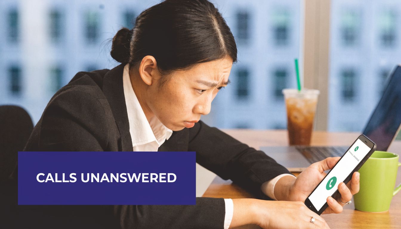 A concerned business woman staring at her smartphone while holding it in an office setting.