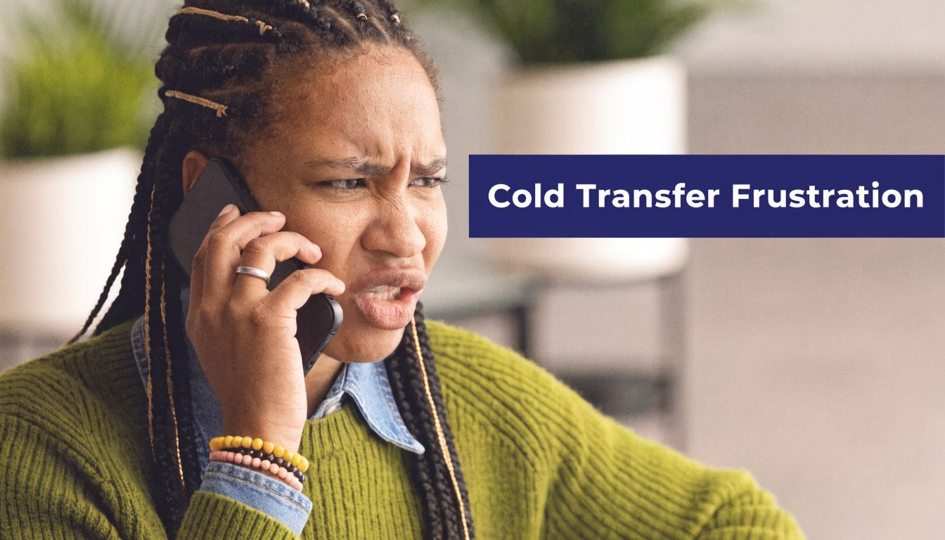 A frustrated woman speaking on the phone, illustrating the annoyance caused by cold transfer calls.