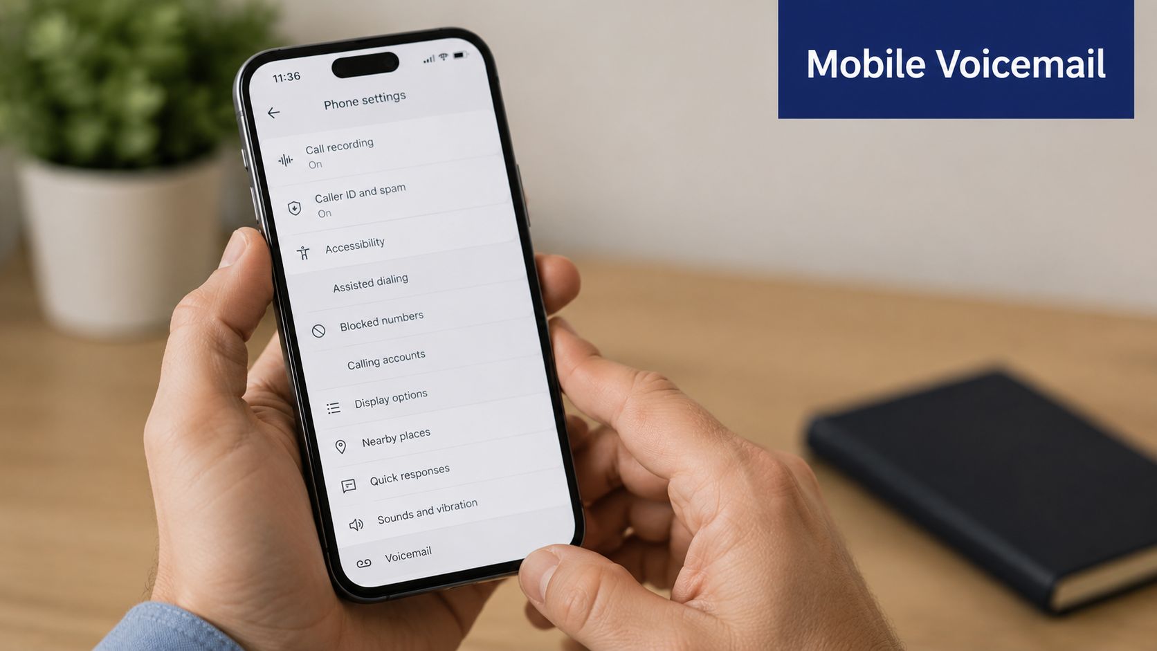 A person holding a smartphone displaying the phone settings menu, focusing on the voicemail configuration option.