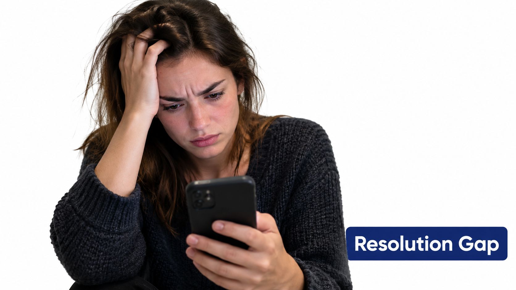 A frustrated young woman looking at her smartphone screen with a distressed expression in a studio.